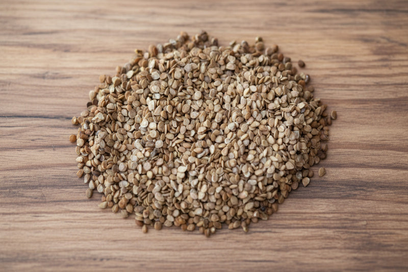 A pile of brown seeds, possibly sunflower seeds, is shown in the image.