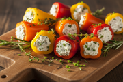Mini Sweet Peppers Stuffed with Herbed Cream Cheese on Rustic Board